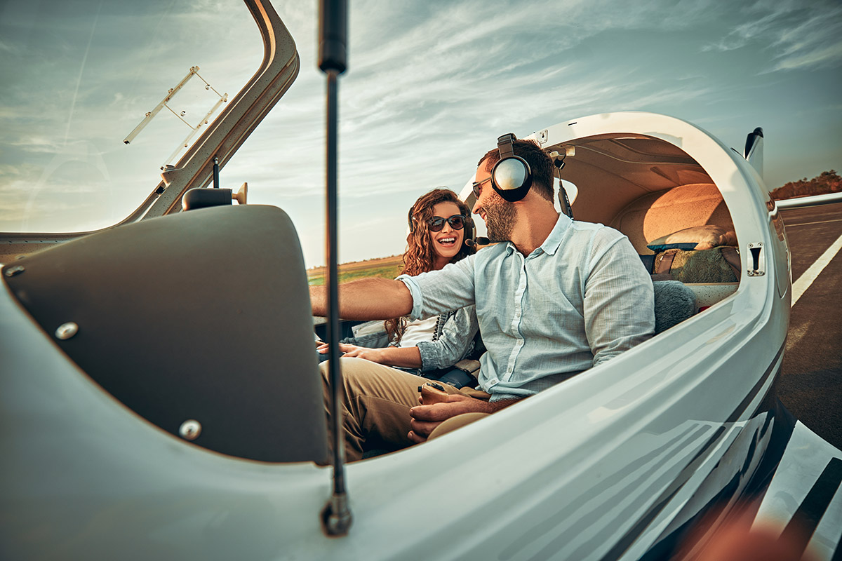 Couple in love in a small private airplane